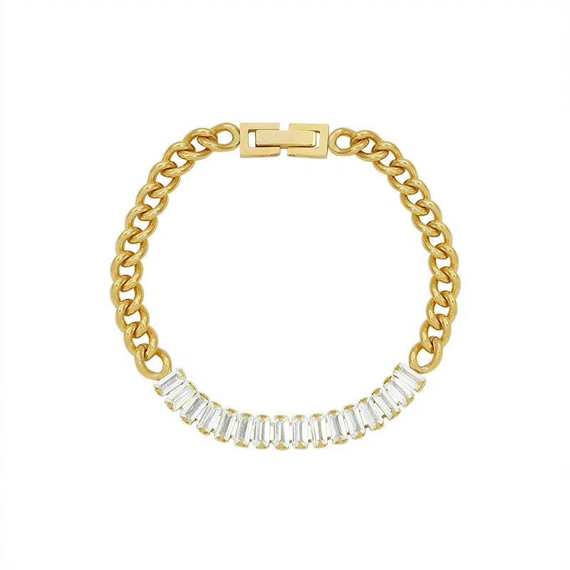 Gold titanium steel geometric matte finish unisex bracelet on flat surface