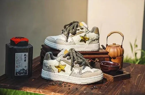 Green low-top canvas casual shoes with star pattern and white stitching on a rubber sole.