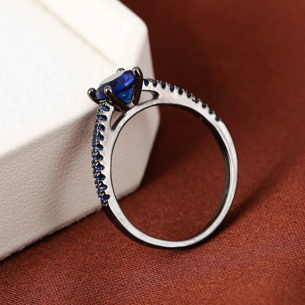 Zircon hexagon ring with geometric design showing electroplated colour options on copper base