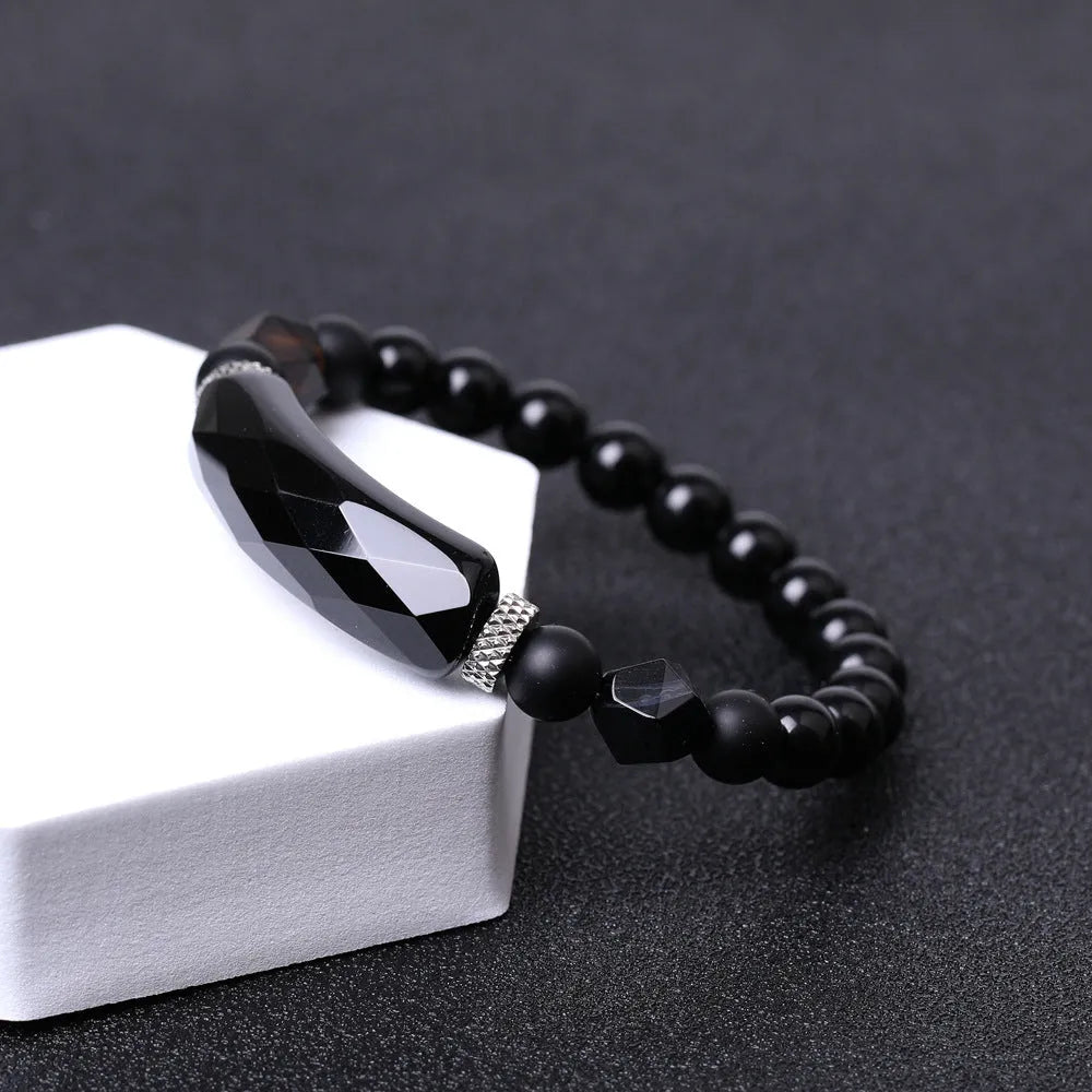 Handmade black agate diamond cut bracelet with geometric fan design on wrist
