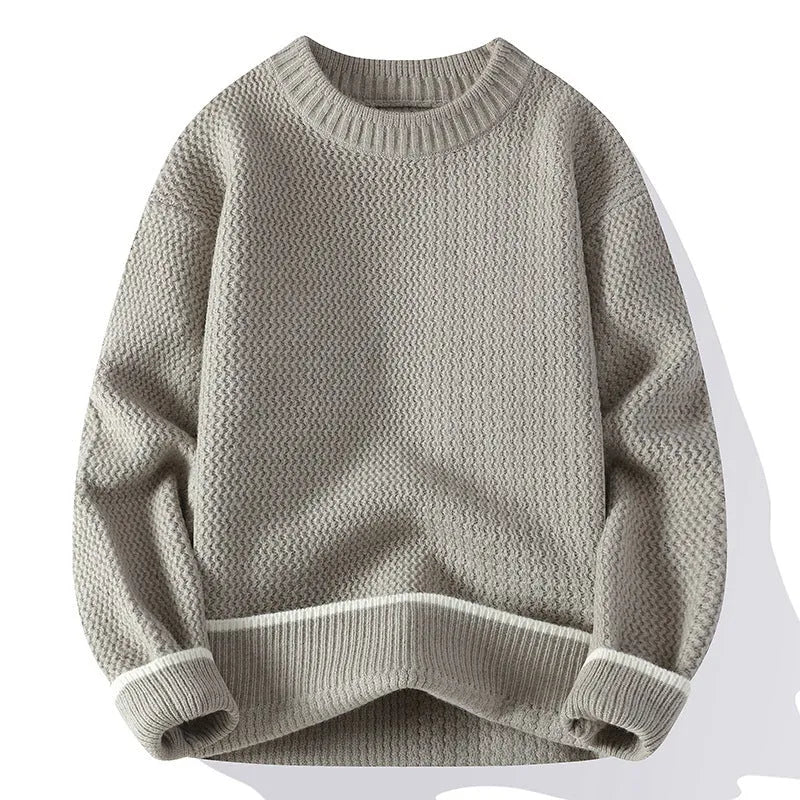 A man's grey loose-fit round-neck long-sleeve casual pullover sweater on a plain background.