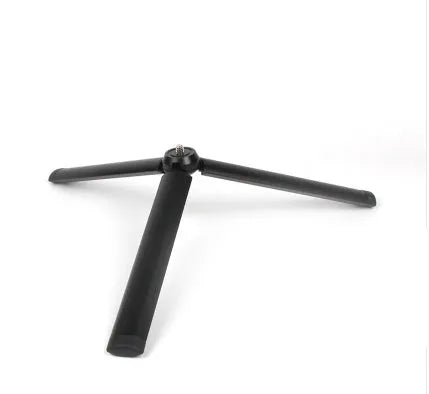 Black aluminium alloy mobile phone tripod and handheld stabiliser with telescopic legs extended.