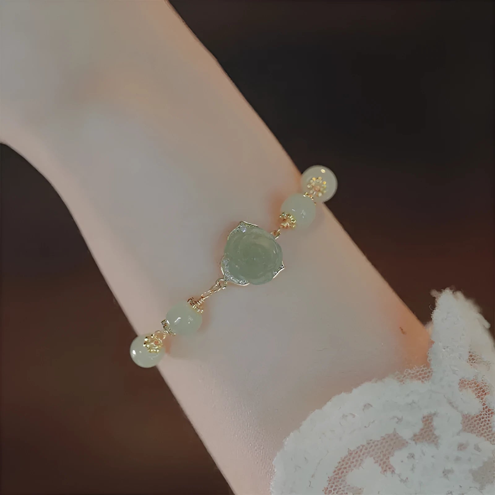 Women's bracelet with Hetian jade rose design and 14K gilded floral elements