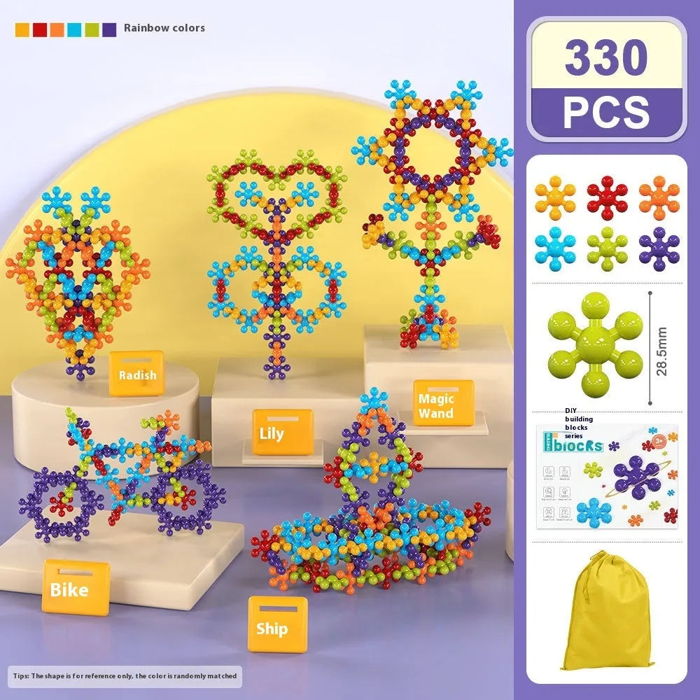 DIY plum blossom building blocks arranged in flower shape with rainbow colour pieces on white background