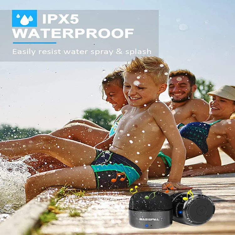 Black portable mini Bluetooth speaker with waterproof rating and button controls.