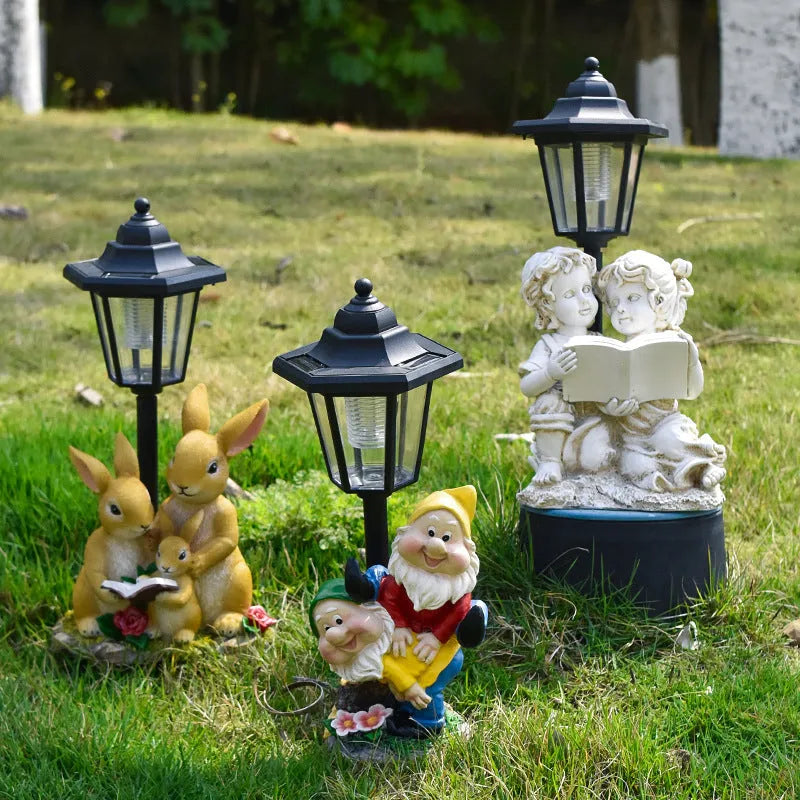 Hexagonal solar garden lamp with synthetic resin construction showing animal figurine design options