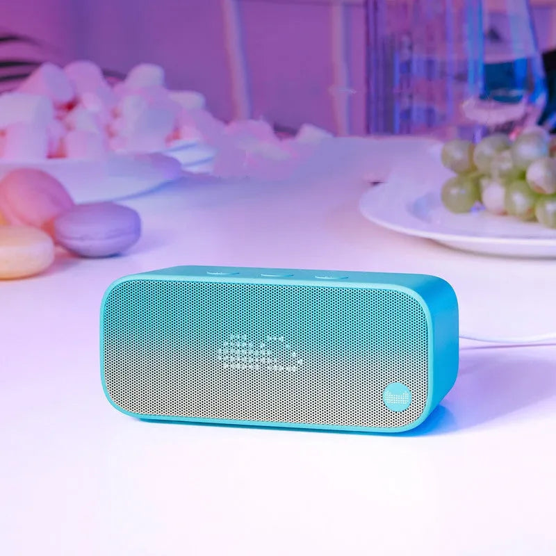 Smart WiFi speaker in blue colour with bookshelf design showing front-facing speaker grille