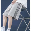 Men's loose-fit track pants in polyester fibre available in three colours and seven sizes