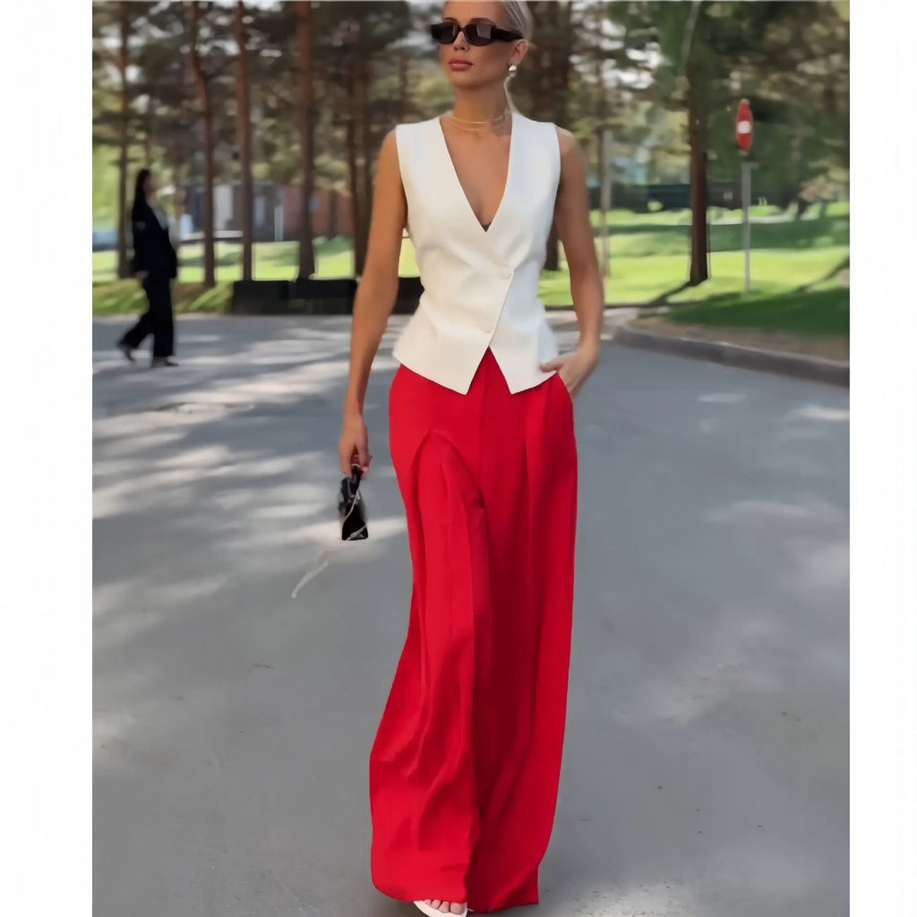 Women's beige two-piece set with deep V-neck sleeveless top and wide leg trousers
