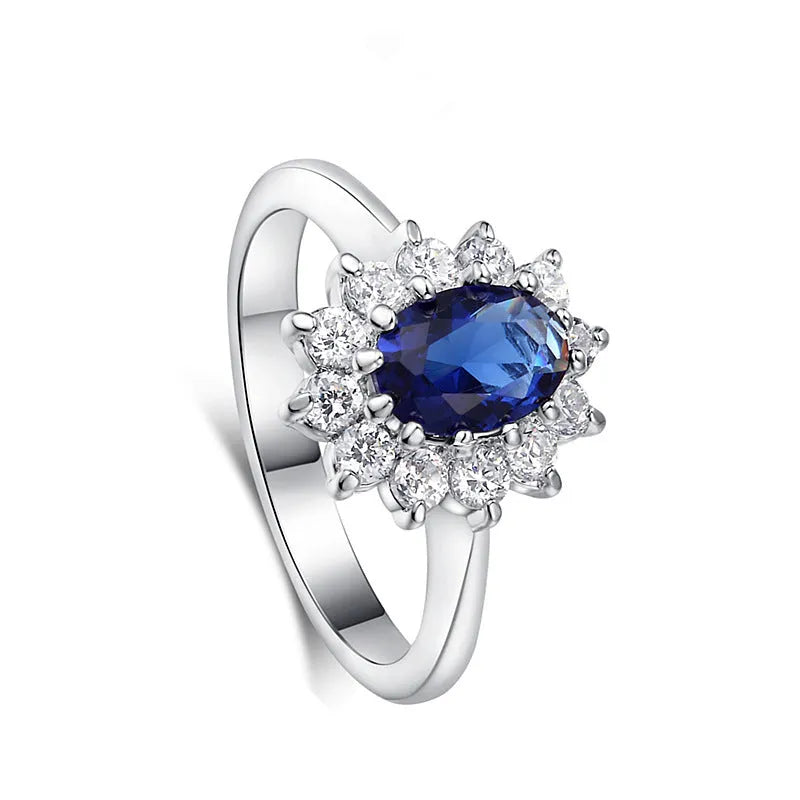 Gold ring with high-grade blue zircon gemstone round cut on white background