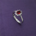 Gold ring with high-grade blue zircon gemstone round cut on white background