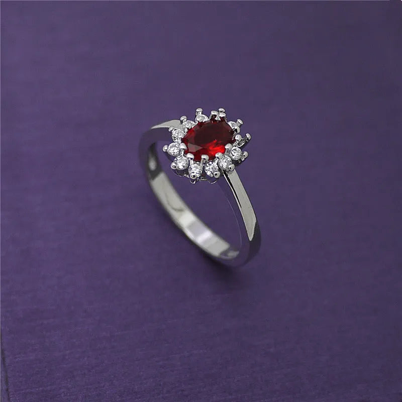 Gold ring with high-grade blue zircon gemstone round cut on white background