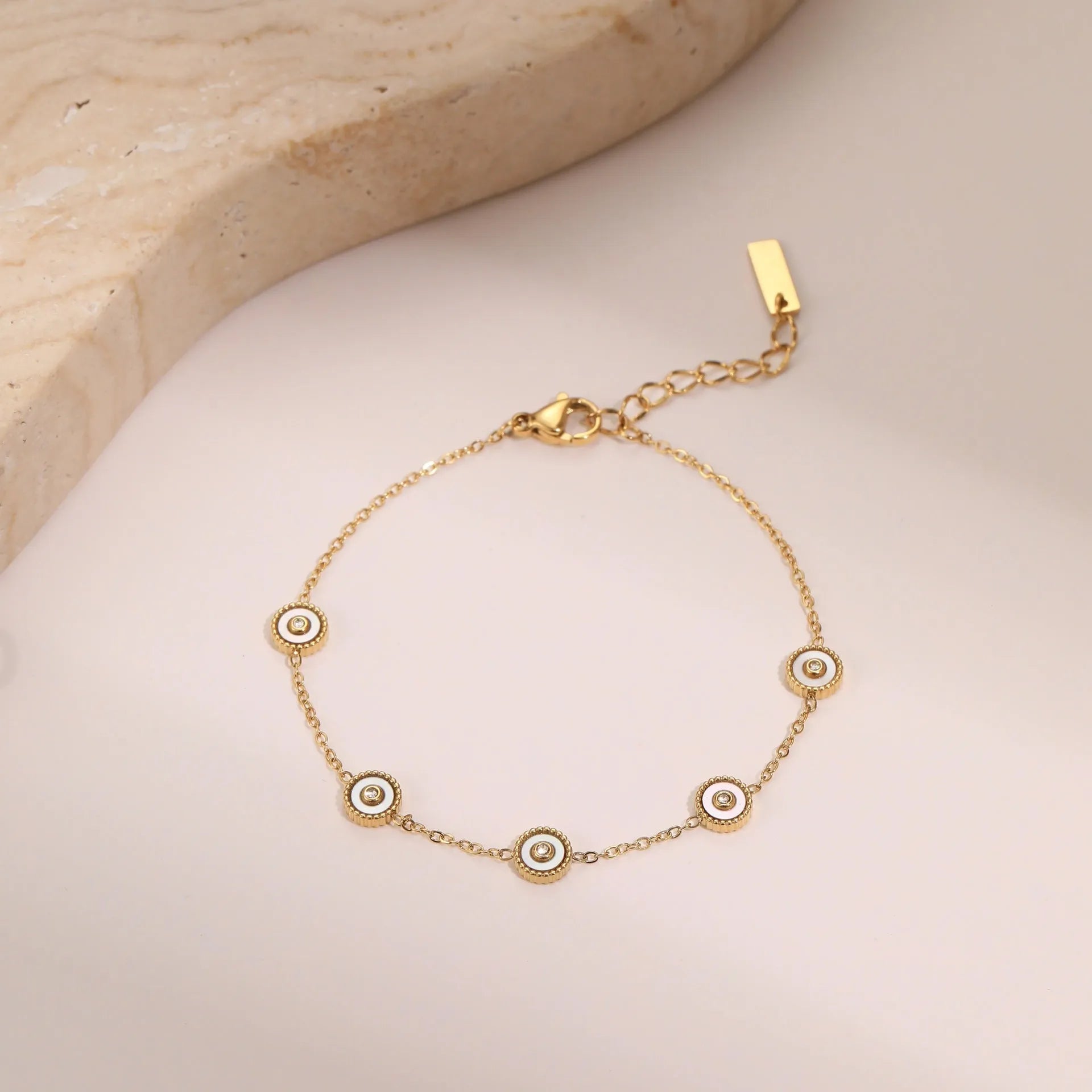 Geometric fritillary pattern stainless steel bracelet with 18K gold plating and matching necklace