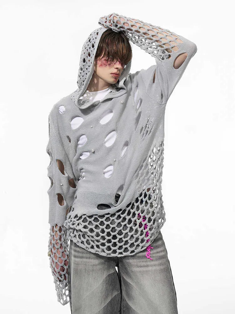 Black men's hoodie with pearl decoration showing loose fit and regular sleeves