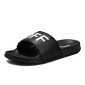 Large size black personalised men's slippers with open toe and rubber sole.