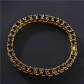 Men's silver geometric chain bracelet with a single row of clear rhinestones on a black background.