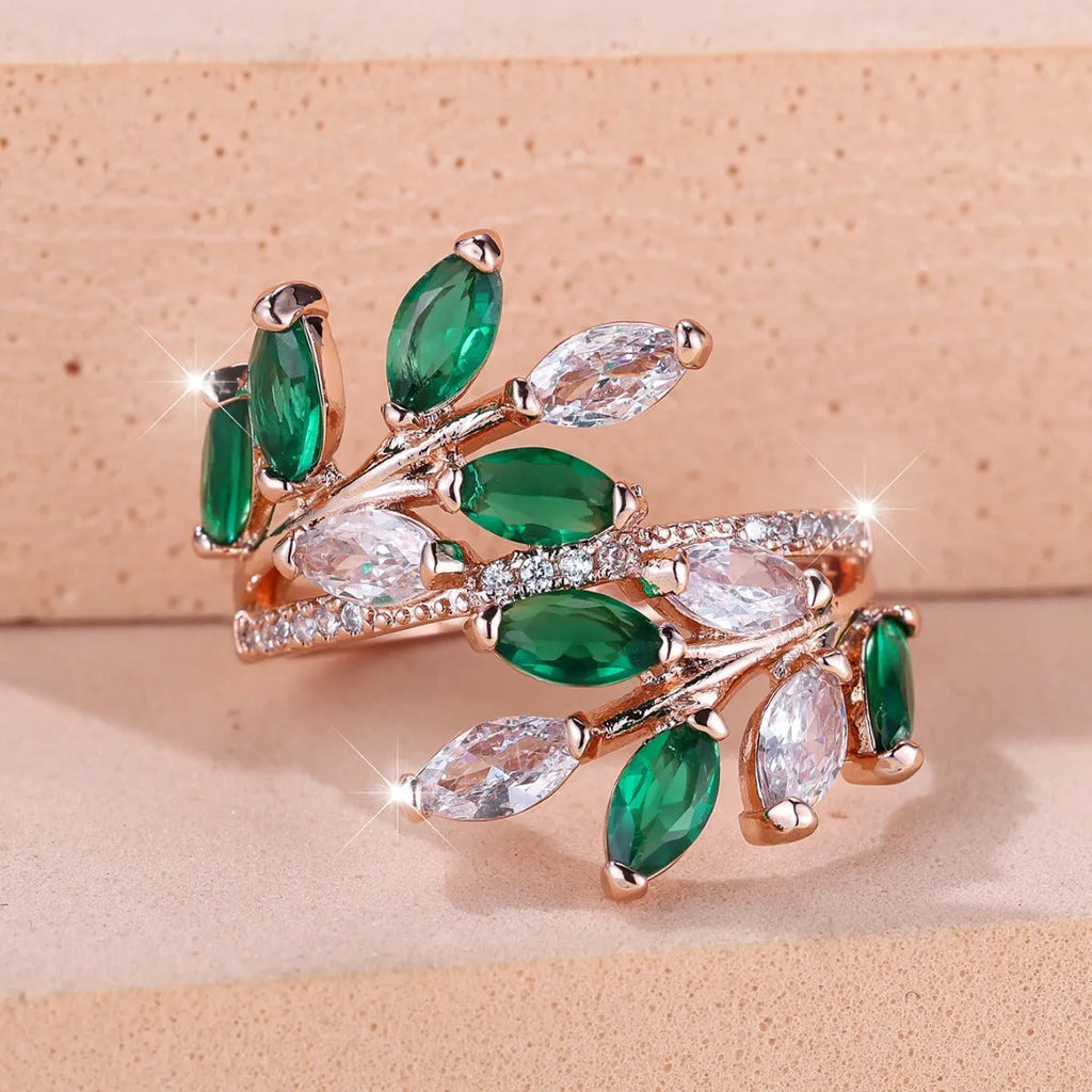 Adjustable copper leaf-shaped fashion ring with a central horse eye zircon stone in a rose gold finish.