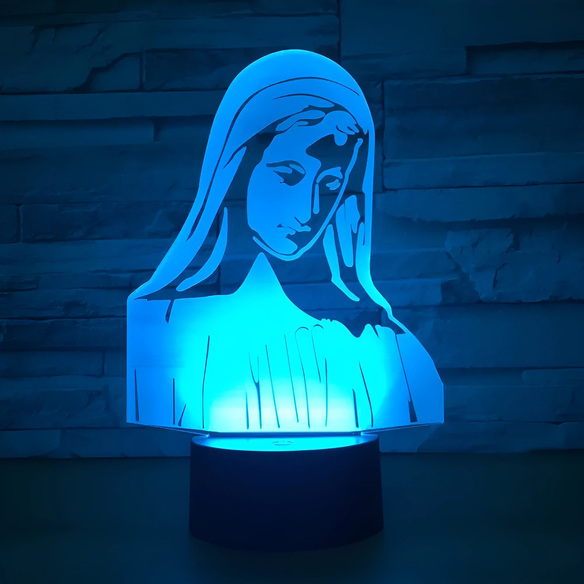 3D LED night light showing a stereoscopic dual-ring light pattern from a thin acrylic panel on an ABS base.