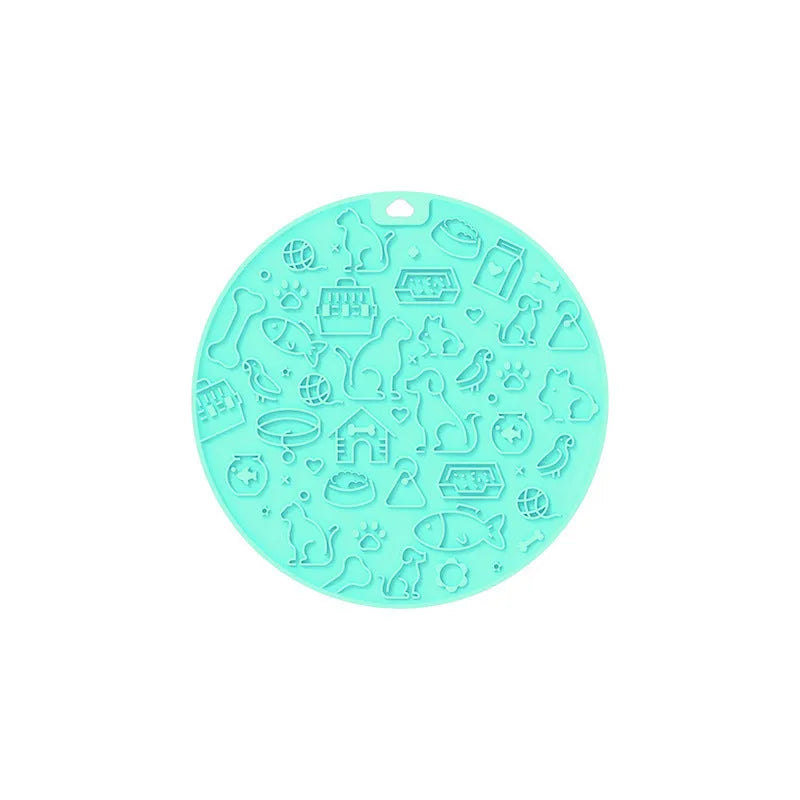 Round silicone pet lick mat in mint colour with suction cup on the underside
