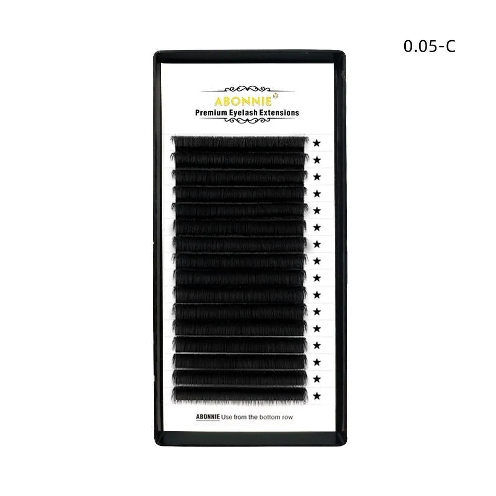 Pack of matte mink hair false eyelashes showing dense 16-row strip on a clear background.