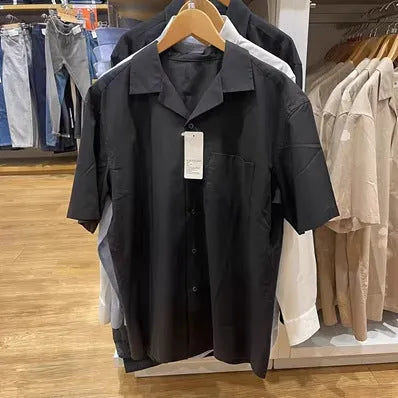 Man wearing a beige modal cotton open collar cardigan-style casual shirt.