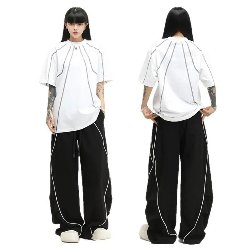 Black pleated wide-leg hip hop sports pants with stripe pattern laid flat