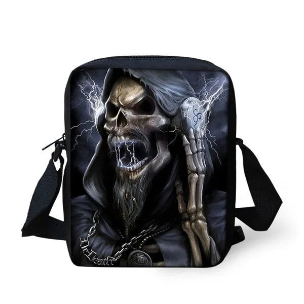 Medium-sized black children's messenger bag with a white skull pattern and double shoulder straps.