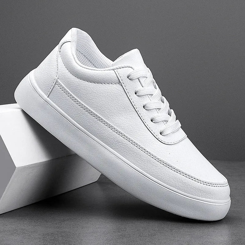 Women's white leather lace-up casual flat shoes on a solid background
