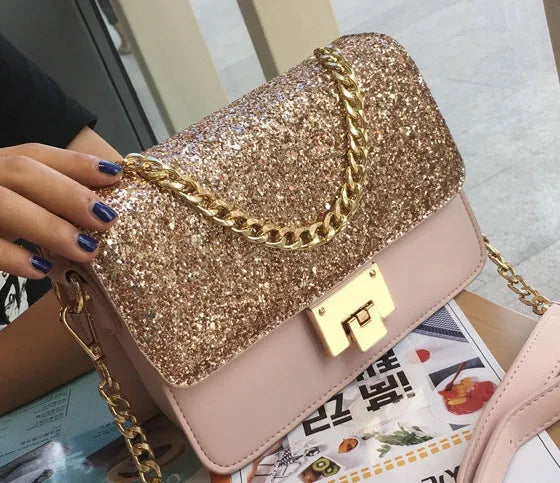 Women's small square sequined PU handbag with lock closure and adjustable shoulder strap in pink, wathet, and black colours 22x16x9cm