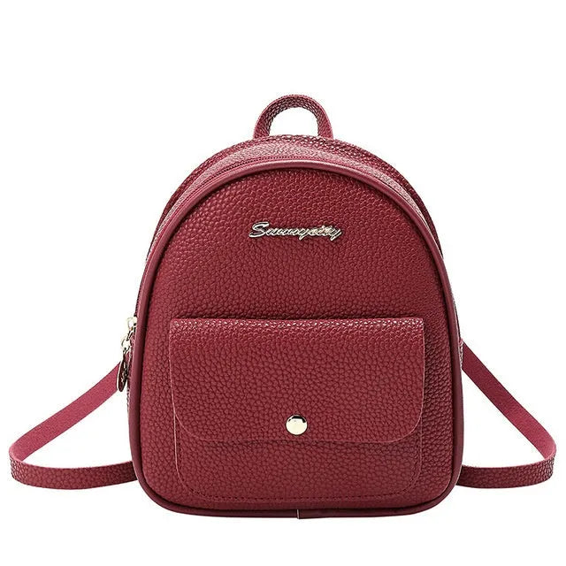 Small PU leather shoulder backpack in black colour showing zipper closure and compact dimensions