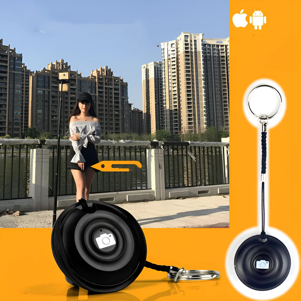 Black Bluetooth remote shutter release for smartphone camera on a white background.