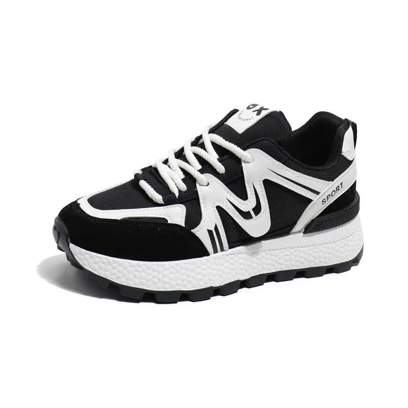 Women's black platform casual shoes with round toe and front lace-up design on a neutral background.