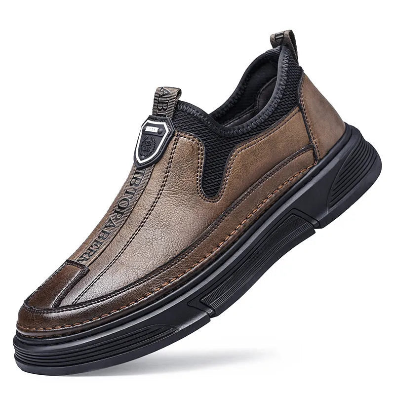 Men's black leather casual shoes with round toe on a plain background.