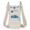Kettle-shaped cycling water bottle bag in black colour mounted on bicycle handlebars