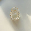 Women's pearl hair barrette in big pearl colour, manual finish, front view