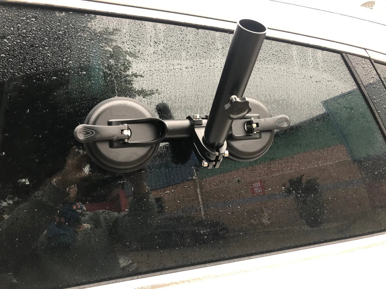 Black off-road car sucker mount with rubber suction cup for attaching flags to vehicle windows.