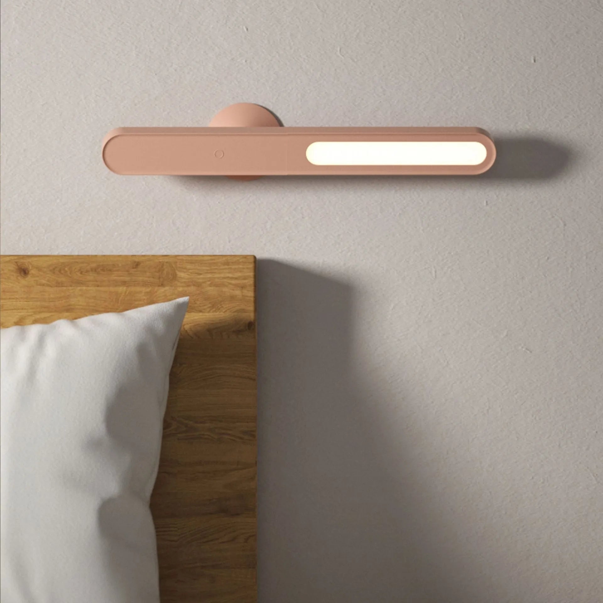 Geometric design table lamp with magnetic base on desk next to USB cable