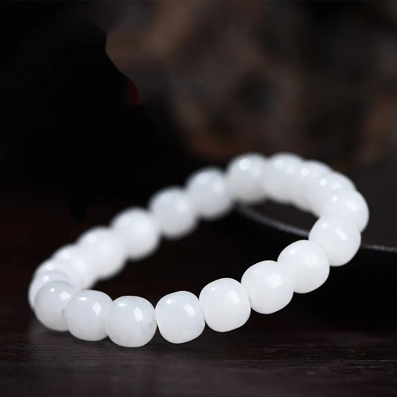 White jade barrel beads bracelet on wrist showing Hetian jade beads in casual unisex design