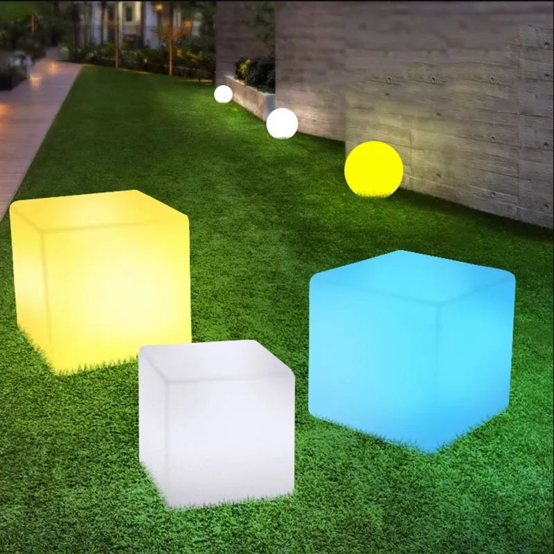 Modern square LED cube light stool in outdoor setting showing waterproof IP65 design