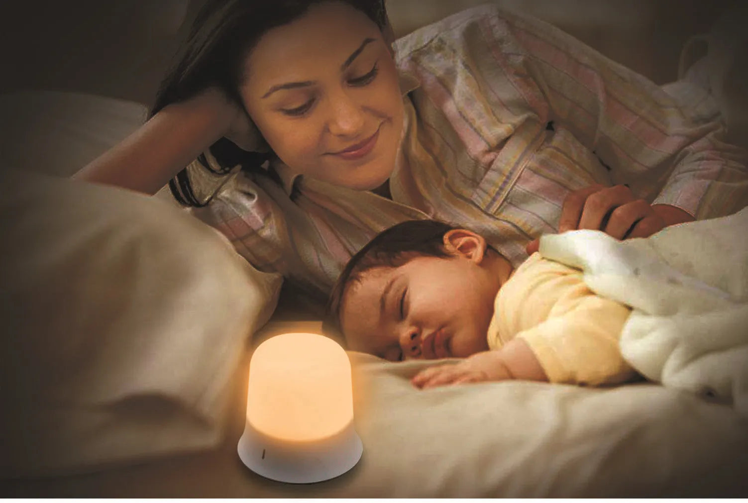 White cylindrical bedside night light with touch controls for dimming and colour changing
