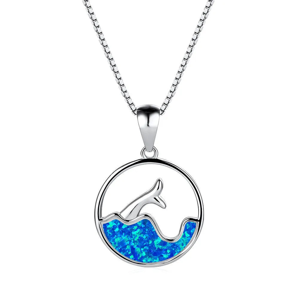 White gold electroplated geometric fishtail pendant necklace with a round blue opal stone.