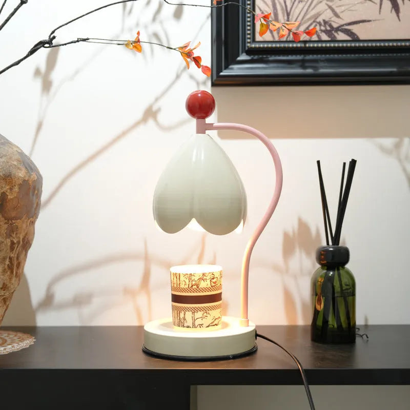 Linglan cream white metal holder melting wax desk lamp on a wooden table.