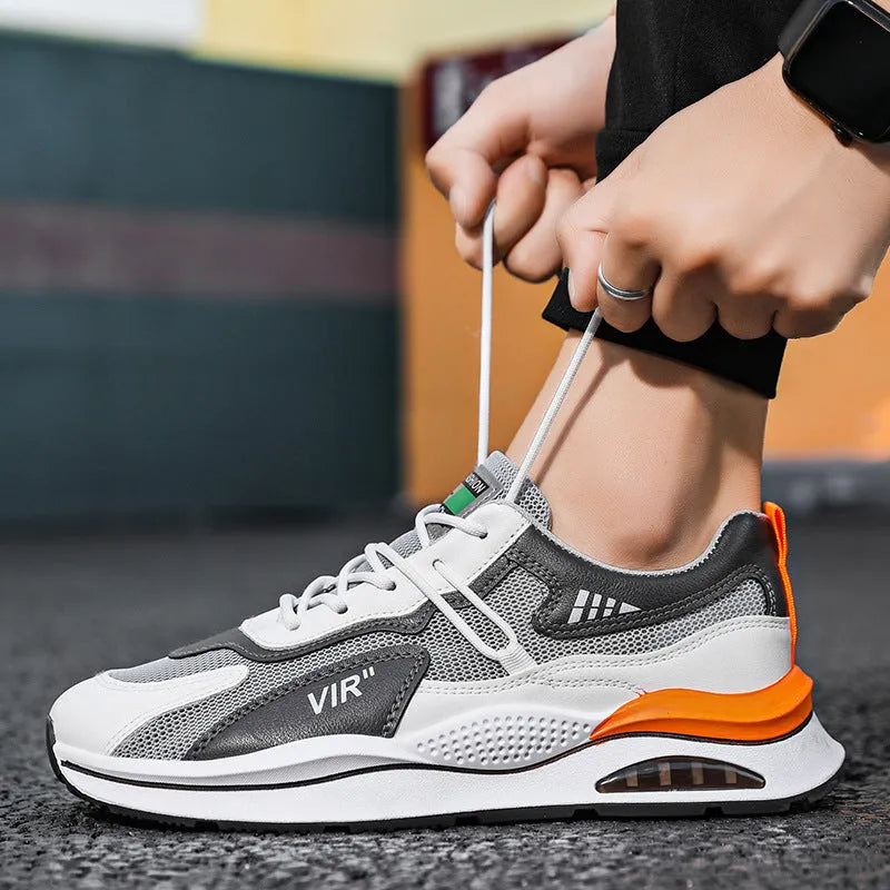 Men's grey breathable mesh casual trainers with a round toe and lightweight EVA sole.