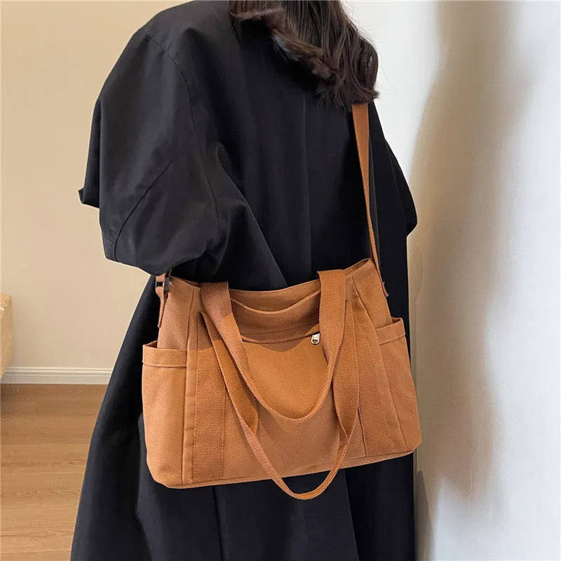 Polyester shoulder bag for women with phone compartment and sandwich pockets in solid colour options