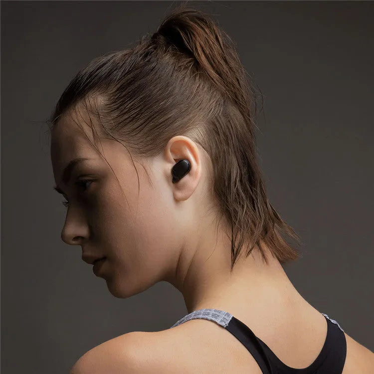 Redmi AirDots black true wireless Bluetooth headphones with charging case.