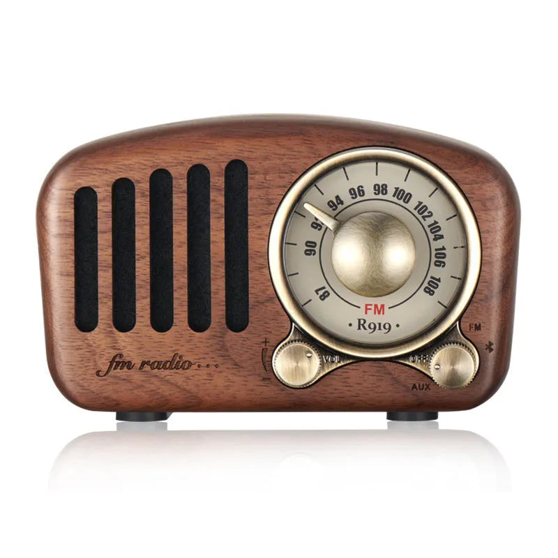 Retro wooden wireless mini speaker in cherry wood or walnut finish, showing compact size