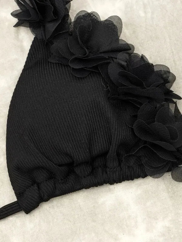 Black polyester two-piece swimsuit set with bikini top and gathered waist shorts.