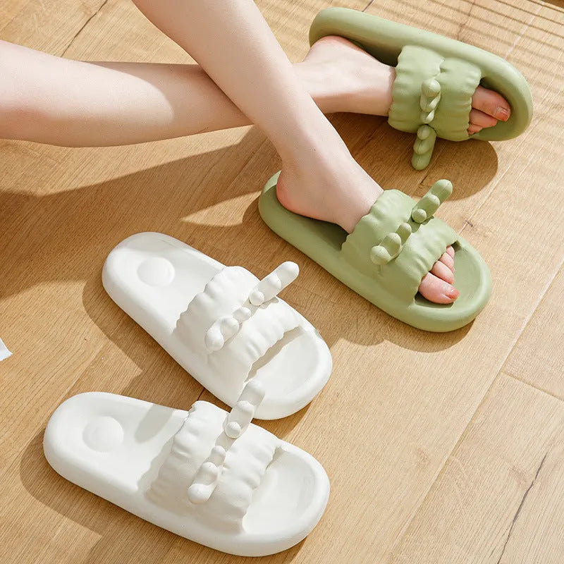 Women's deer horn design EVA flip flop slippers in light yellow colour on a white background.