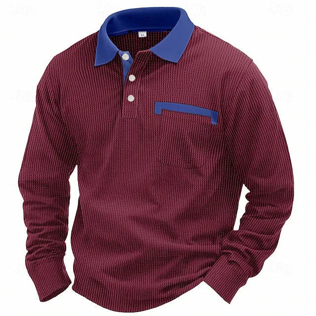 Man wearing a long-sleeved waffle-texture polo shirt with an asymmetric design in a dark colour.