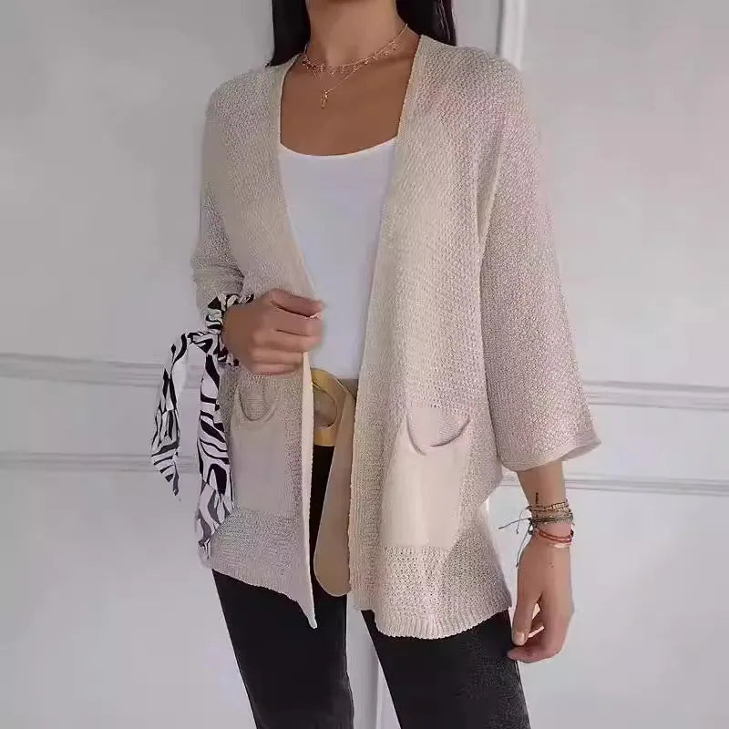 Women's waffle knit cardigan coat with nine-quarter length sleeves and pockets in army green.